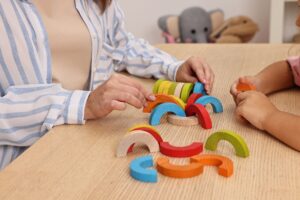 Therapist with client showing the difference between aba therapy vs occupational therapy.